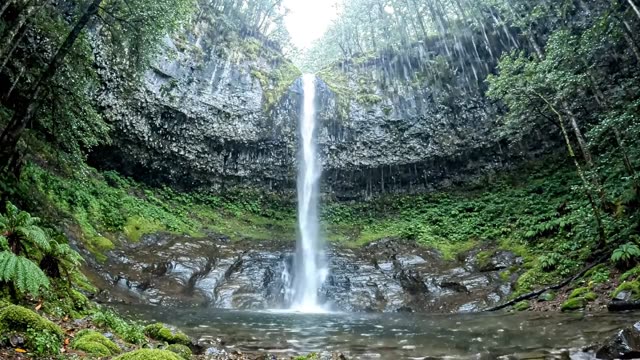 A long thin waterfall seen from below looking up (2)